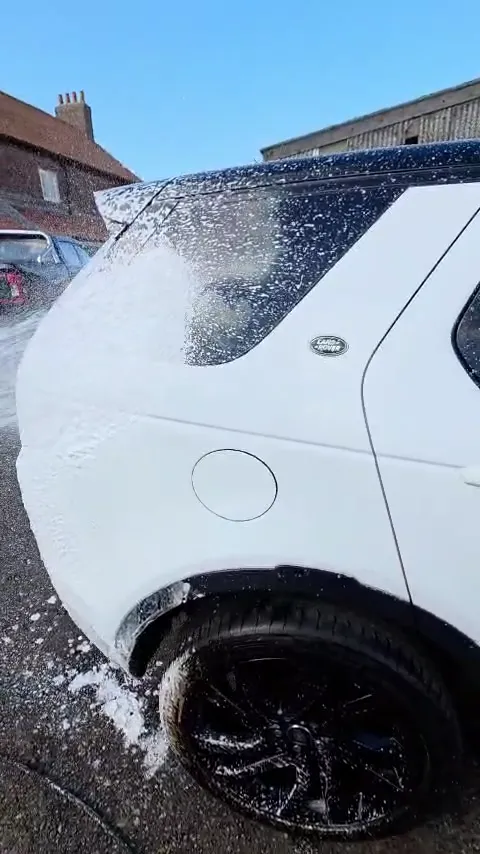 Snow foam on a white Land Rover Discovery Sport