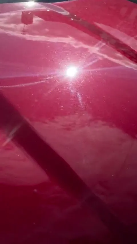 Deep gloss on red paintwork after machine polishing