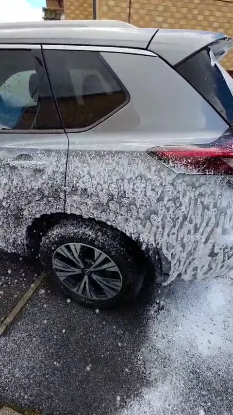 Snow foam on a silver SUV